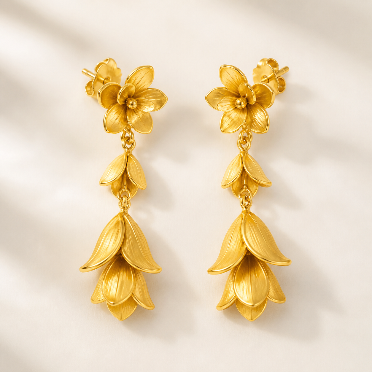 Pair of 22K yellow-gold floral petal drop earrings