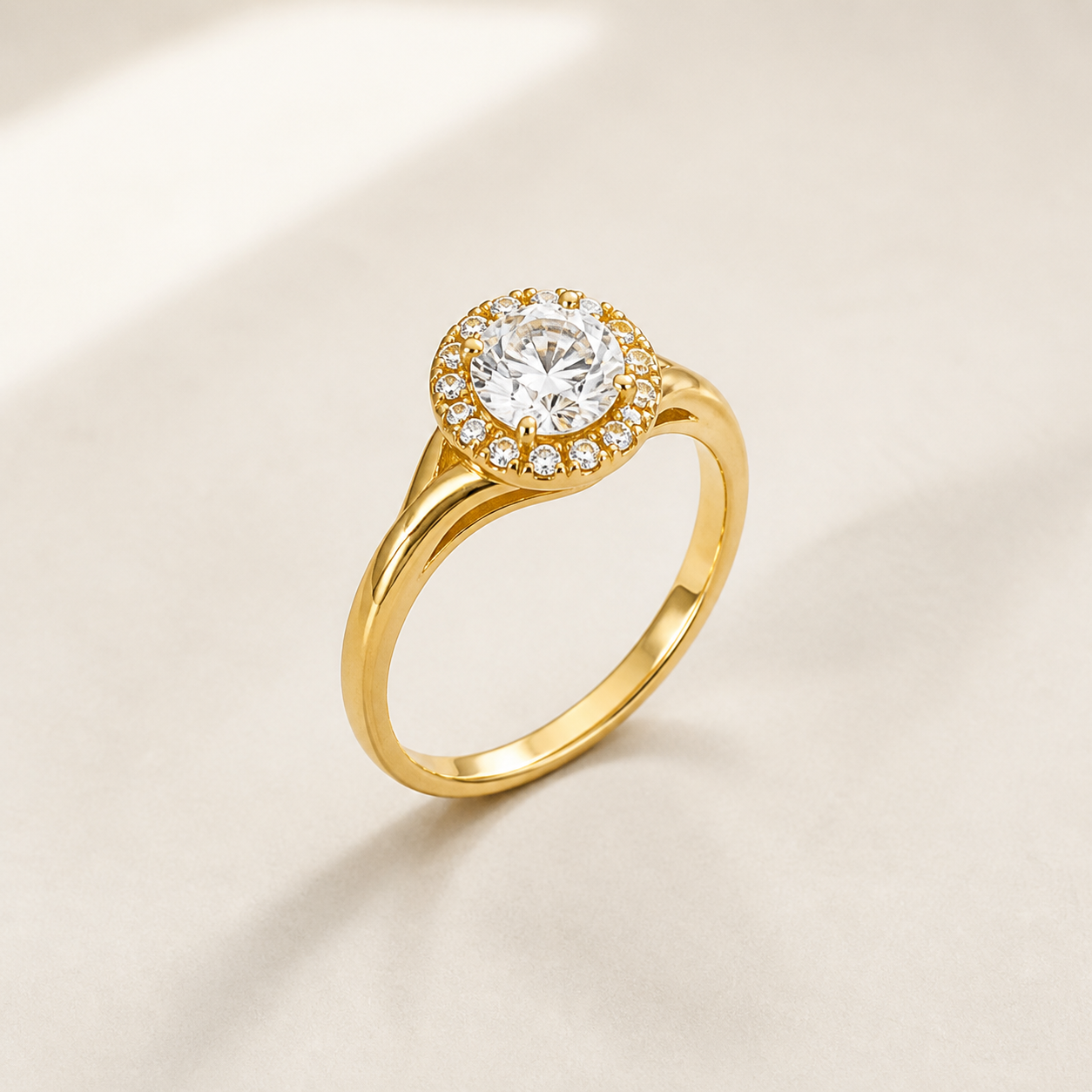 Sculpted 21K yellow-gold halo ring in a front three-quarter view